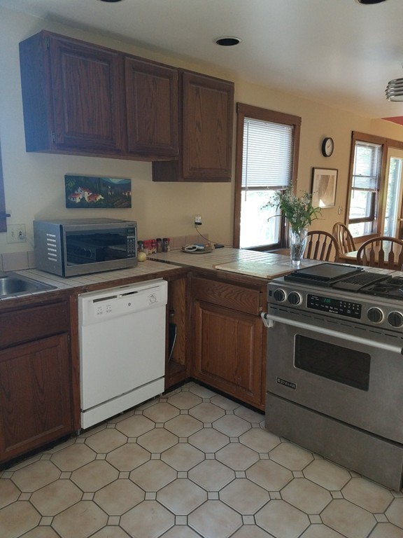 116 West Monomonac Road Winchendon, MA 01475 - Photo 11 of 22 a kitchen with a stove sink and cabinets