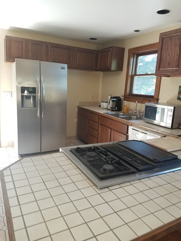 116 West Monomonac Road Winchendon, MA 01475 - Photo 12 of 22 a kitchen with granite countertop a sink stainless steel appliances and cabinets