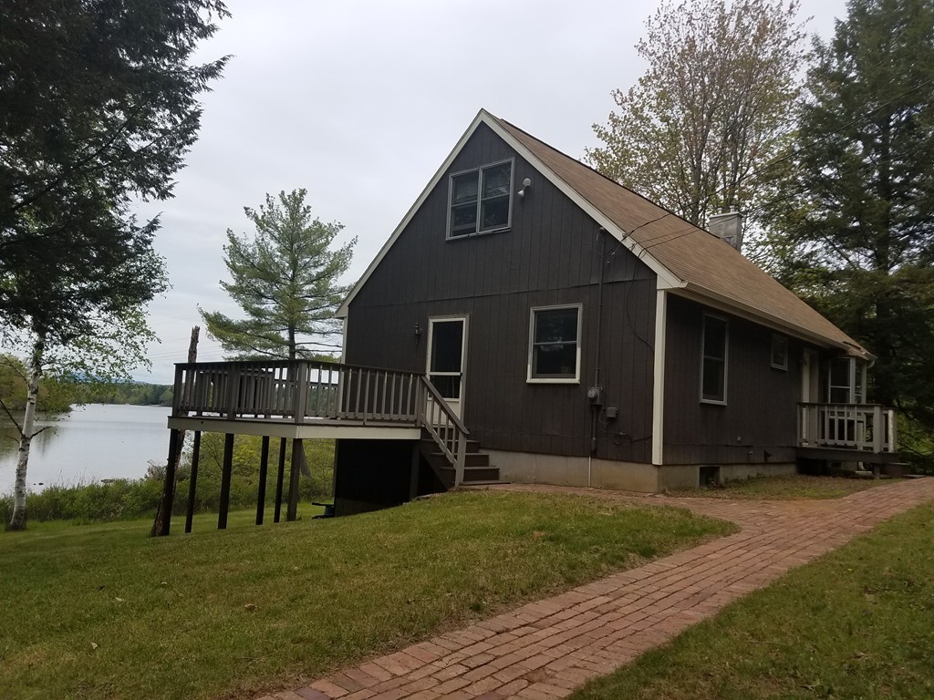 116 West Monomonac Road Winchendon, MA 01475 - Photo 3 of 22 a front view of house with yard and trees in the background