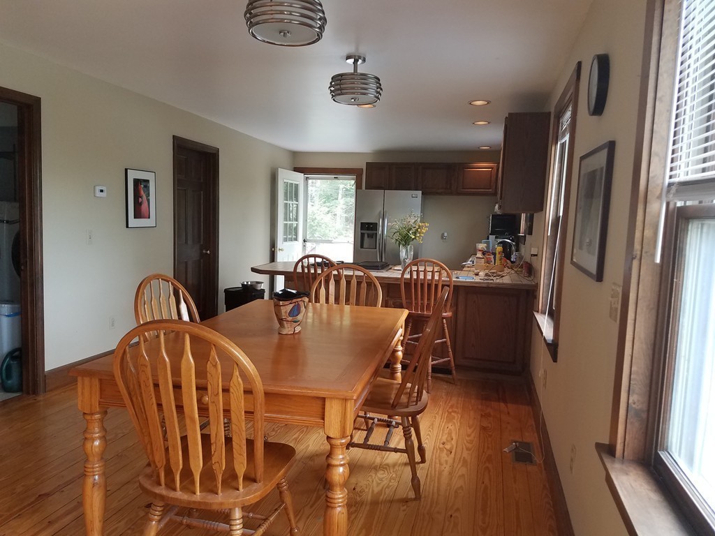 116 West Monomonac Road Winchendon, MA 01475 - Photo 10 of 22 a dining room with furniture a window and wooden floor