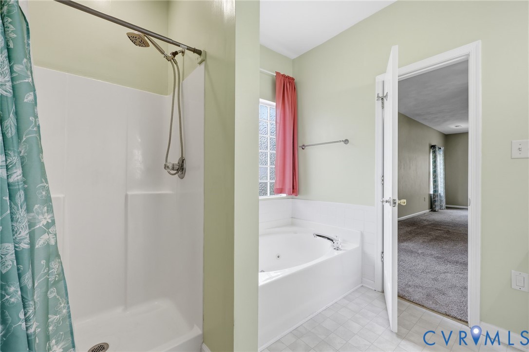 14719 Clover Ridge Lane Chesterfield, VA 23832 - Photo 18 of 36 Bathroom featuring a stand-up shower, a separate b