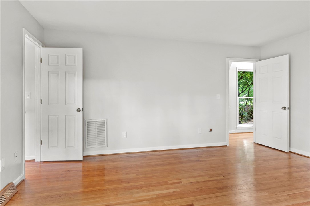 225 Arrowhead Trail Easley, SC 29642 - Photo 11 of 30 Hardwood floors and natural light elevate this inviting living space.