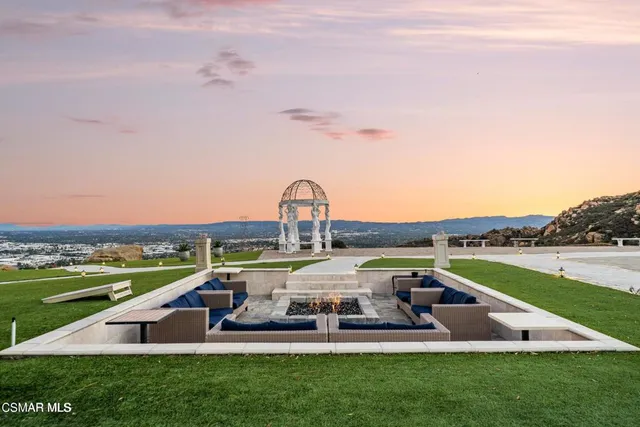 a view of a balcony with two chairs and a table