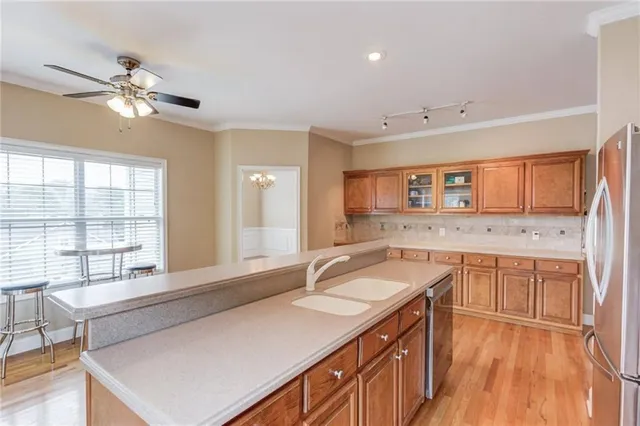 a spacious bathroom with a sink a large mirror and a bathtub