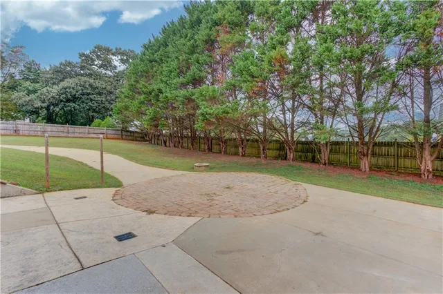 a backyard of a house with lots of green space
