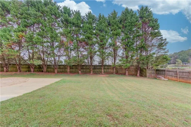 a view of a house with backyard porch and sitting area