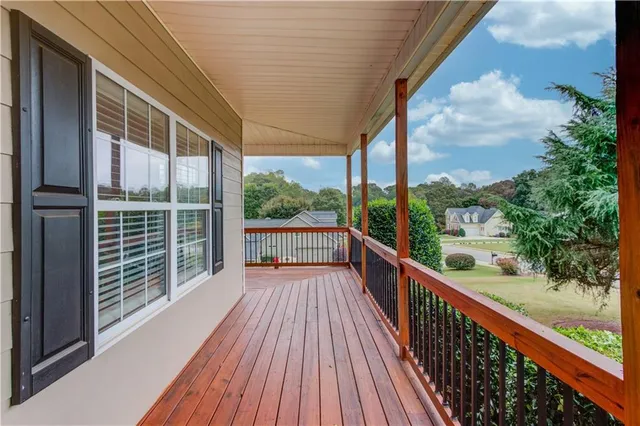 a view of balcony with wooden floor