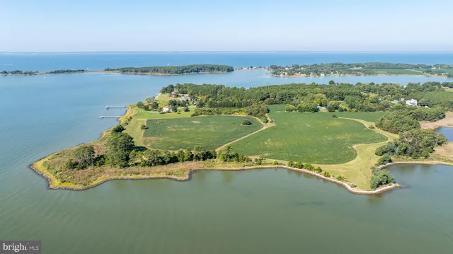 an aerial view of a residential houses with outdoor space and swimming pool