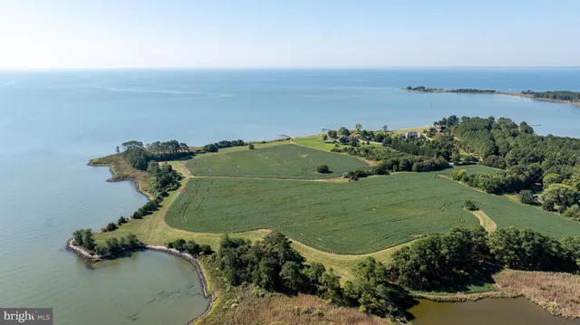 an aerial view of a golf course with chairs