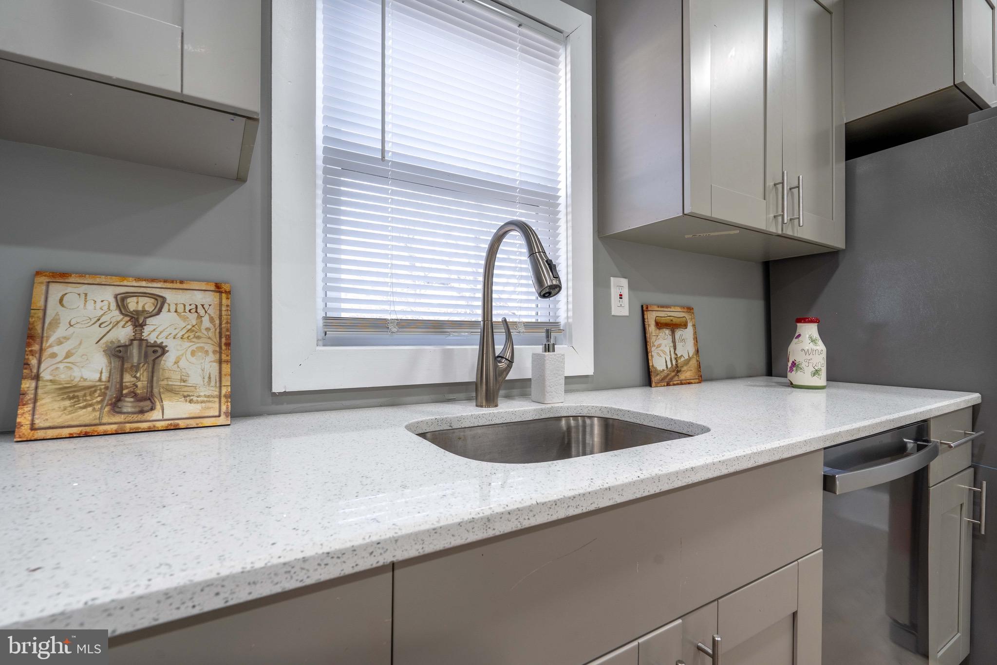 2172 Atco Avenue Atco, NJ 08004 - Photo 12 of 35 a kitchen with a sink and a wooden floor