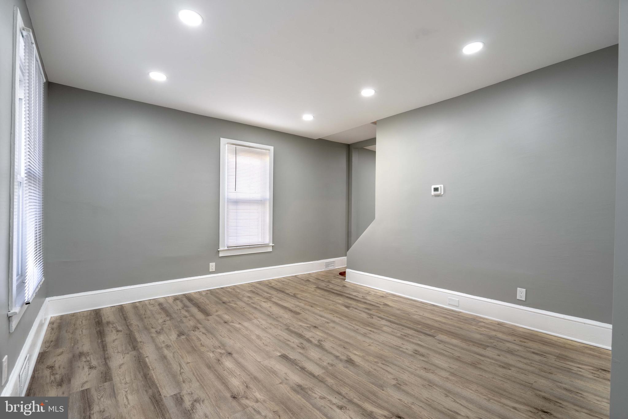 2172 Atco Avenue Atco, NJ 08004 - Photo 15 of 35 an empty room with wooden floor and windows