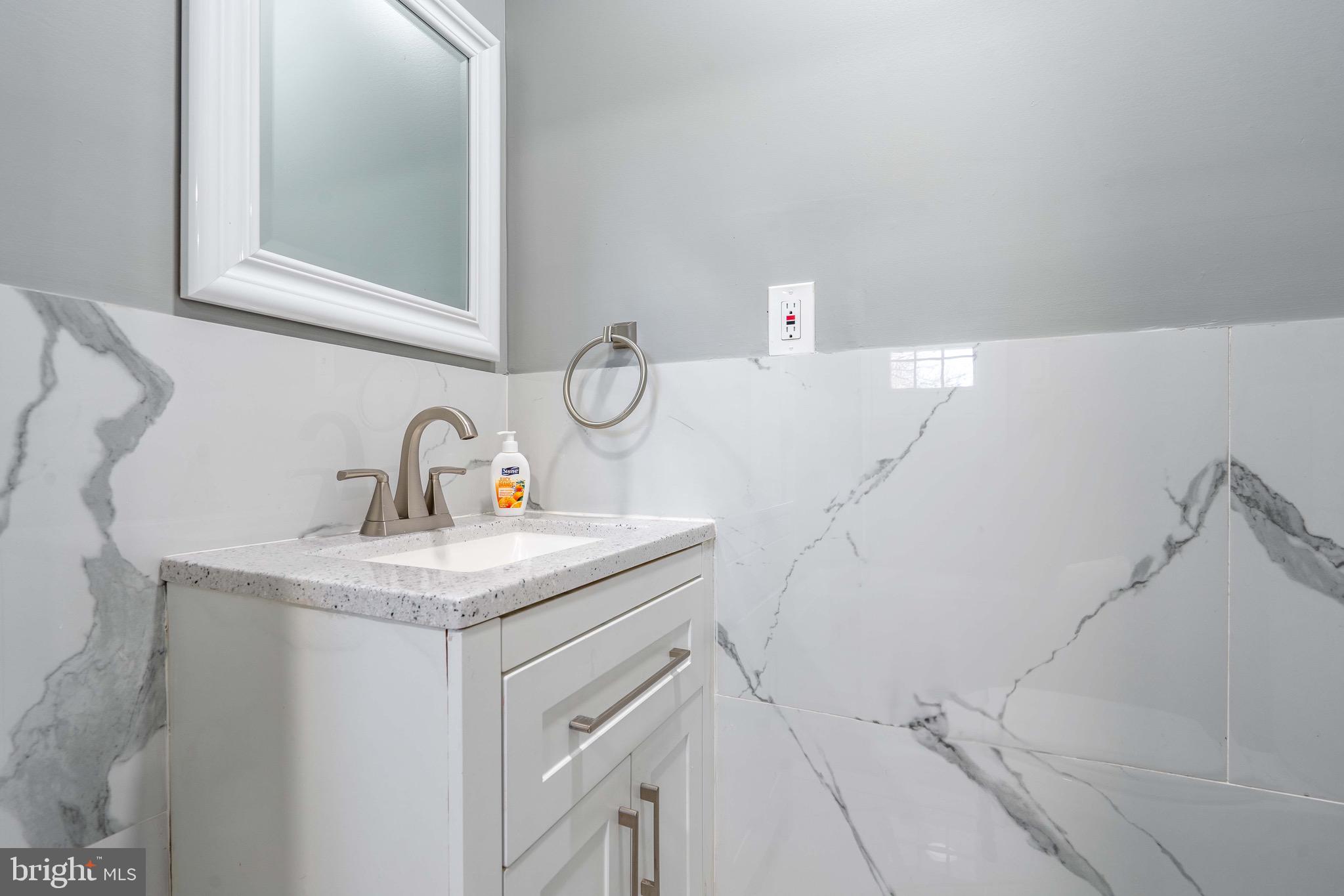 2172 Atco Avenue Atco, NJ 08004 - Photo 21 of 35 a bathroom with a sink and mirror