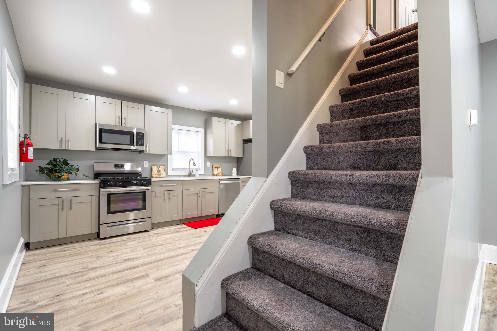 2172 Atco Avenue Atco, NJ 08004 - Photo 7 of 35 a kitchen with granite countertop lots of stainless steel appliances wooden cabinets and a refrigerator