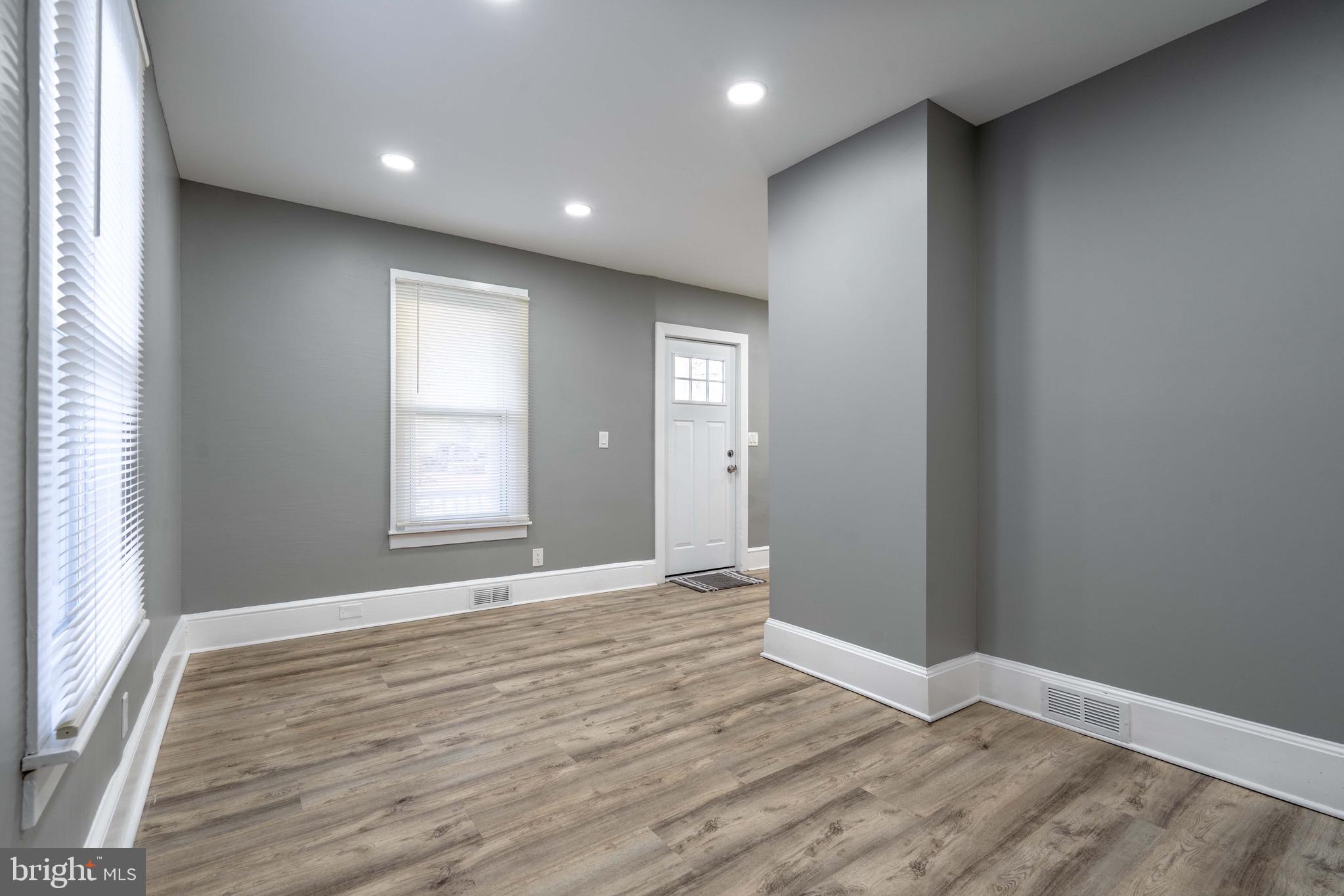 2172 Atco Avenue Atco, NJ 08004 - Photo 9 of 35 an empty room with wooden floor and windows