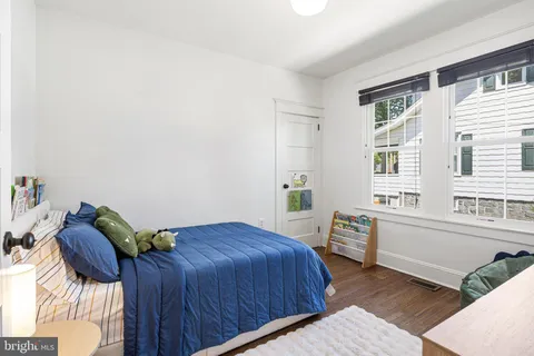 a view of livingroom with furniture wooden floor and windows