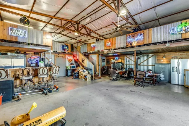 a view of a house with swimming pool and sitting area