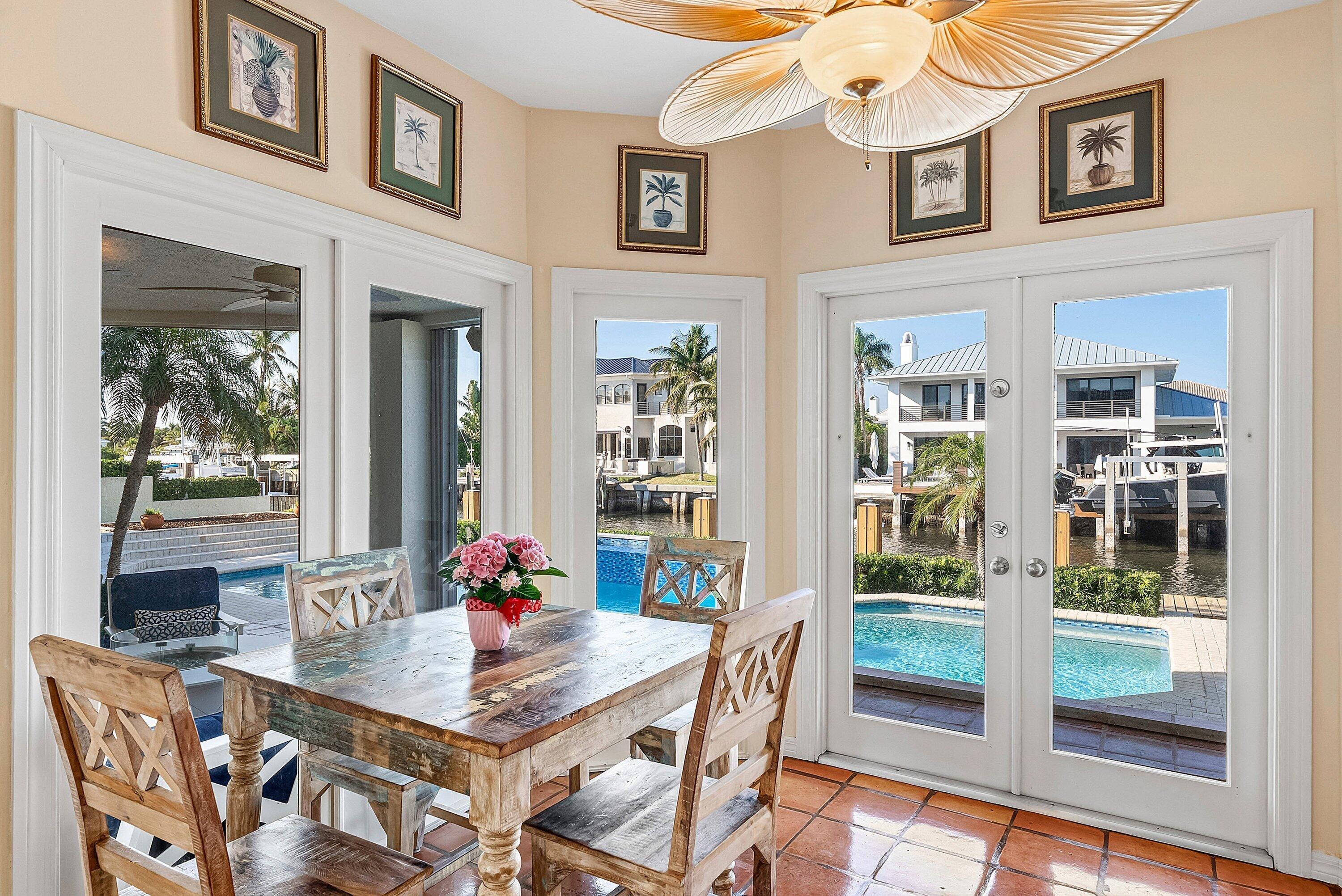 11 Inlet Cay Drive Ocean Ridge, FL 33435 - Photo 16 of 47 a living room with furniture a flat screen tv and a table