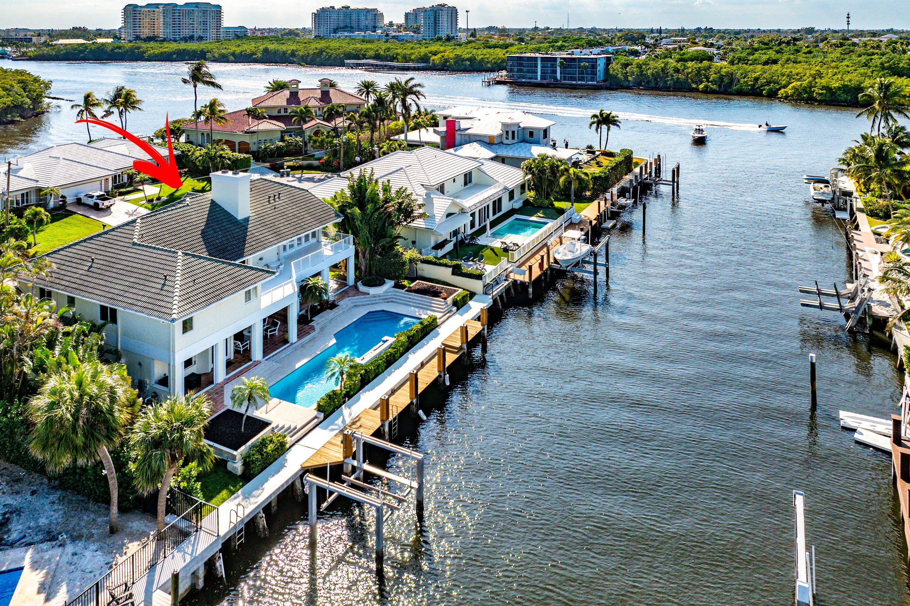 11 Inlet Cay Drive Ocean Ridge, FL 33435 - Photo 2 of 47 an outdoor space with seating