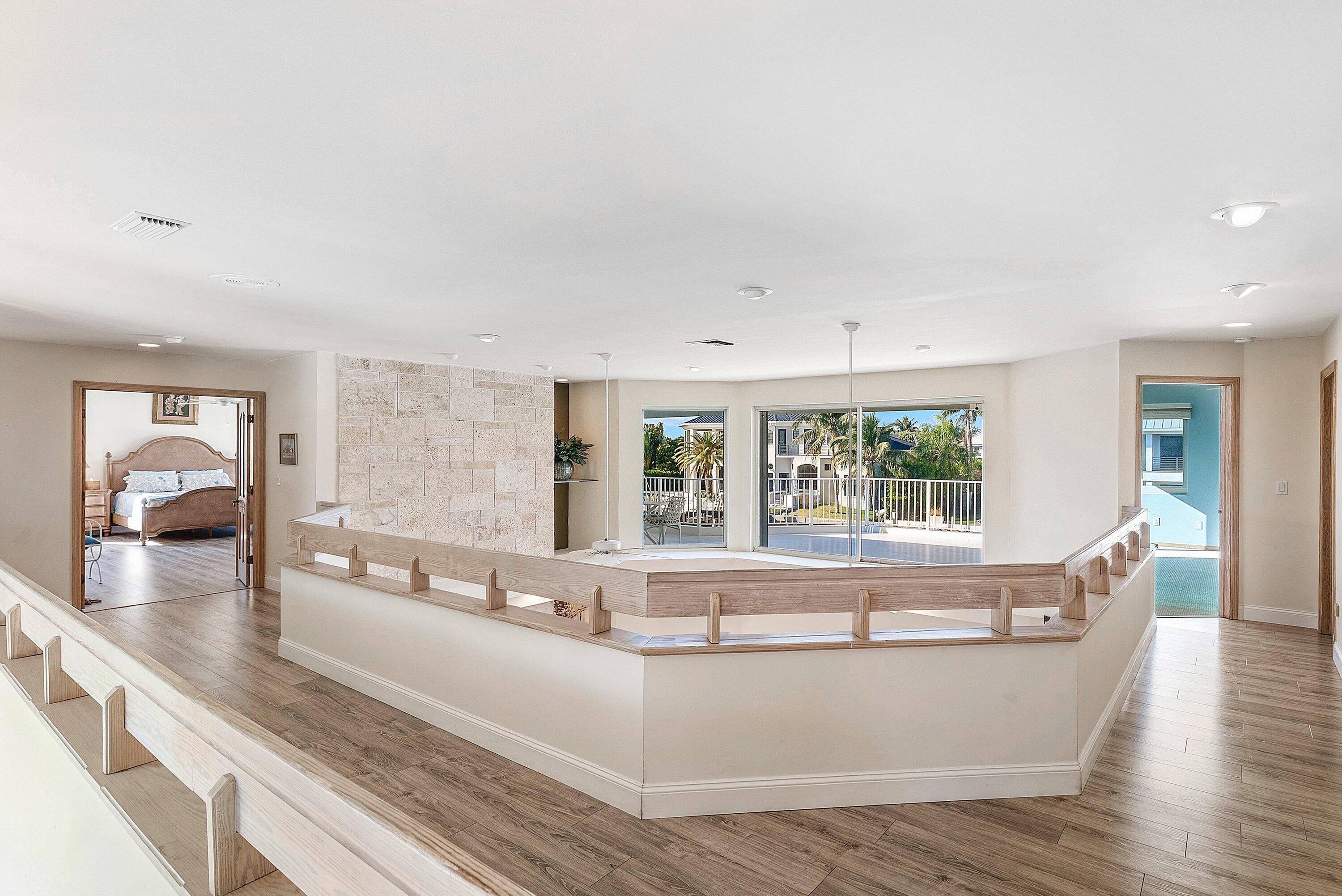 11 Inlet Cay Drive Ocean Ridge, FL 33435 - Photo 24 of 47 a living room with granite countertop furniture a fireplace and windows