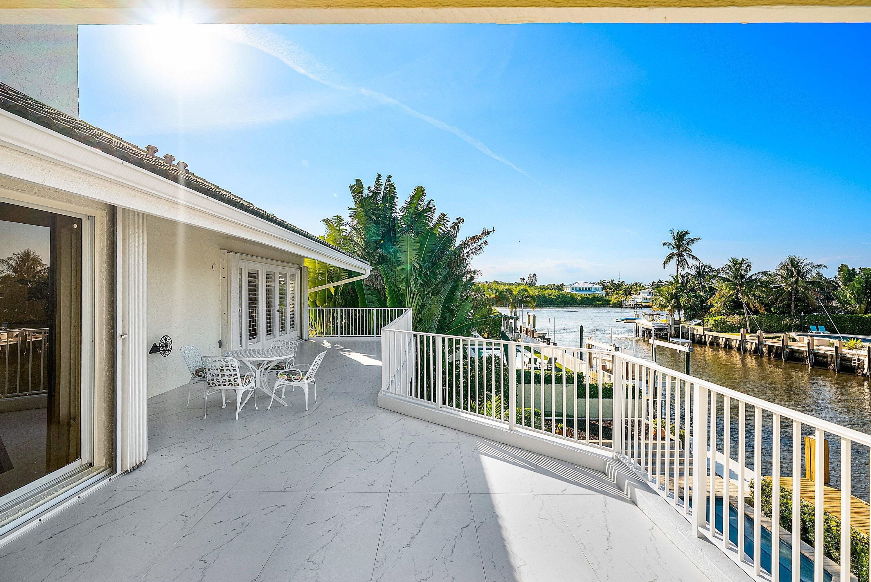 11 Inlet Cay Drive Ocean Ridge, FL 33435 - Photo 35 of 47 a view of a chair and table in the balcony