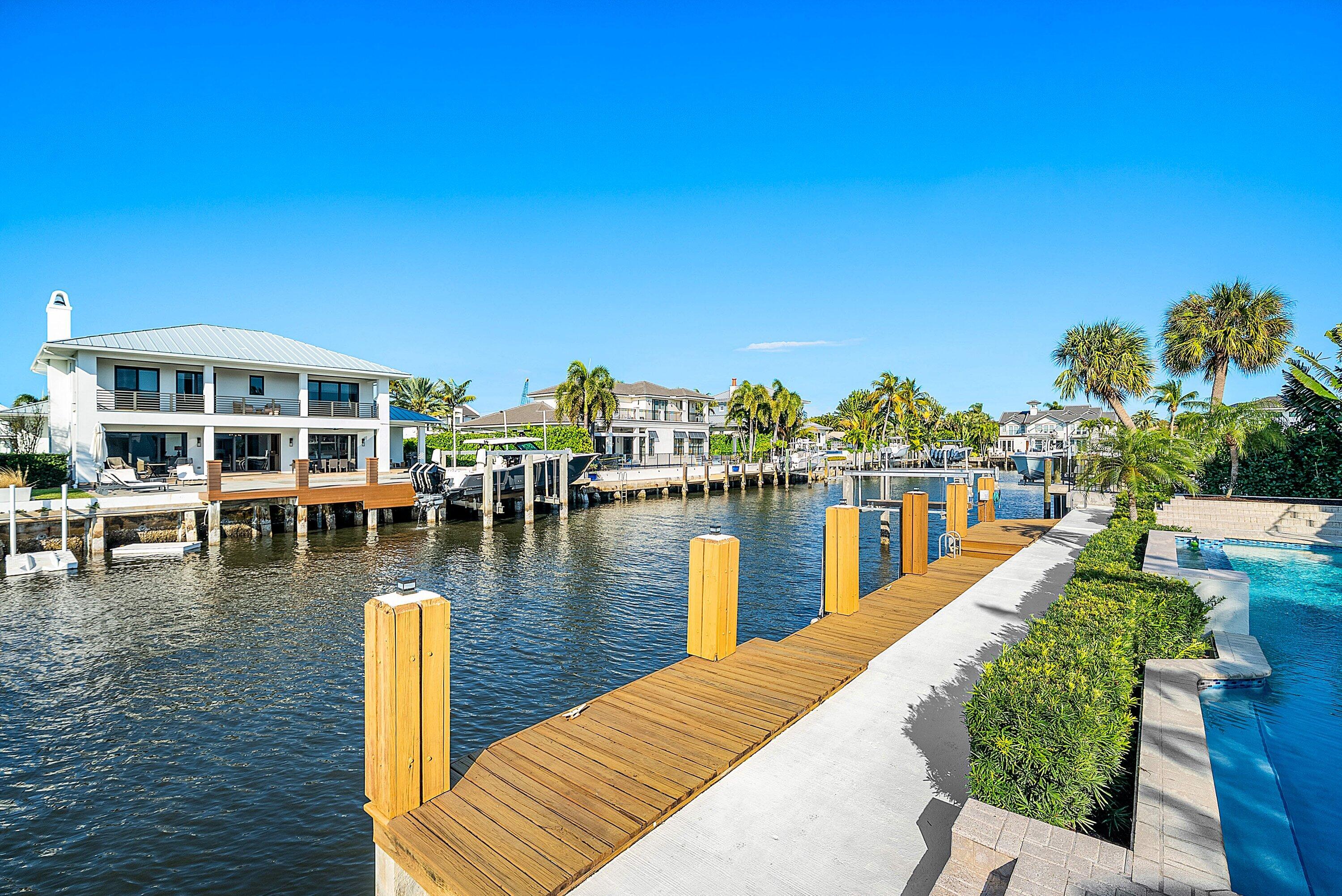 11 Inlet Cay Drive Ocean Ridge, FL 33435 - Photo 42 of 47 a view of a lake with houses