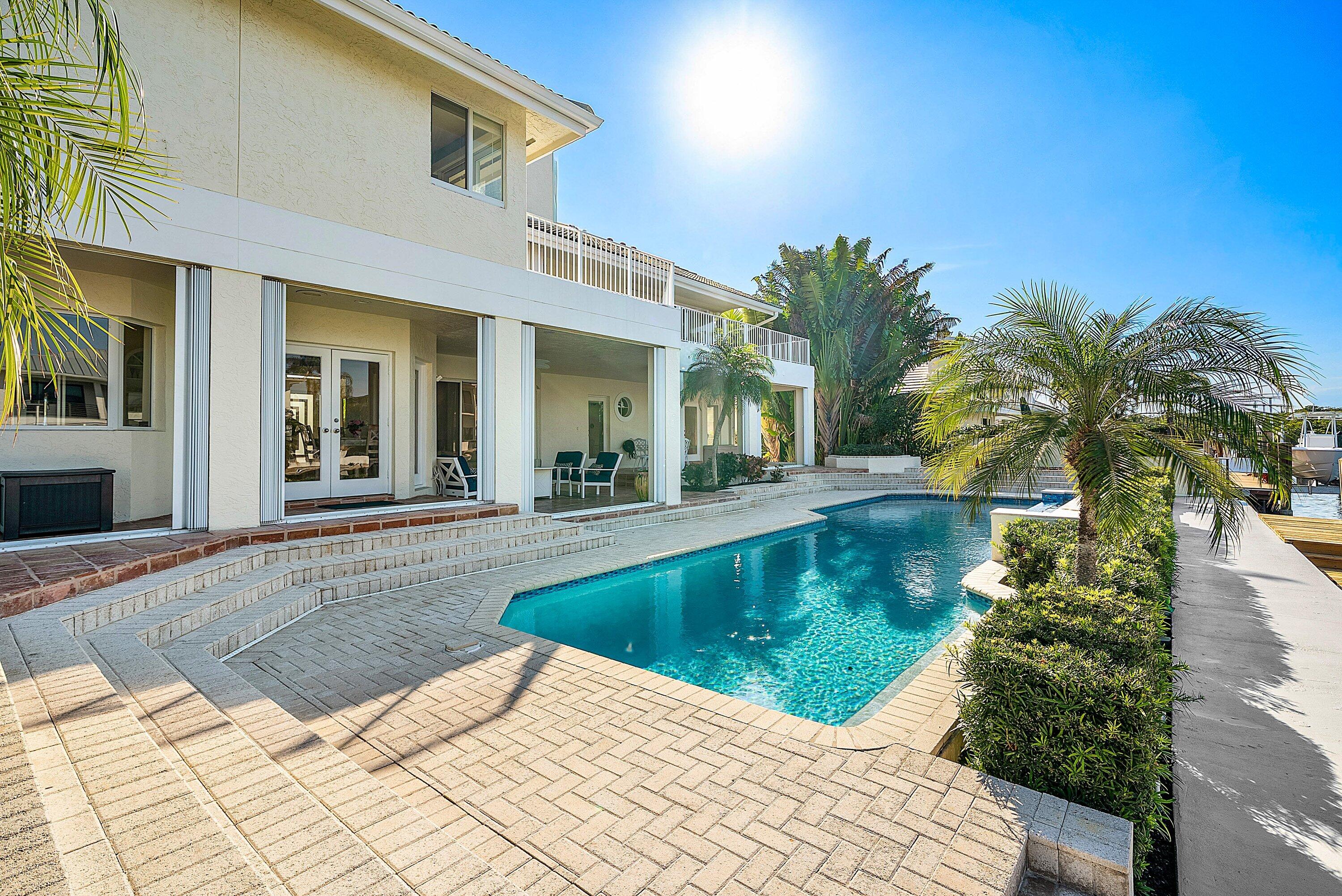 11 Inlet Cay Drive Ocean Ridge, FL 33435 - Photo 43 of 47 a view of a house with swimming pool and sitting area