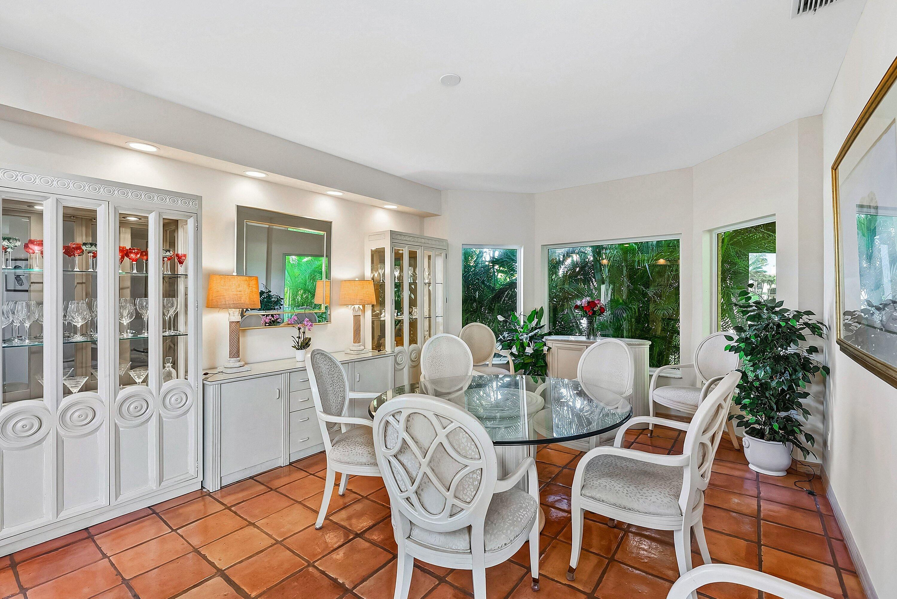 11 Inlet Cay Drive Ocean Ridge, FL 33435 - Photo 10 of 47 a living room with furniture and a floor to ceiling window
