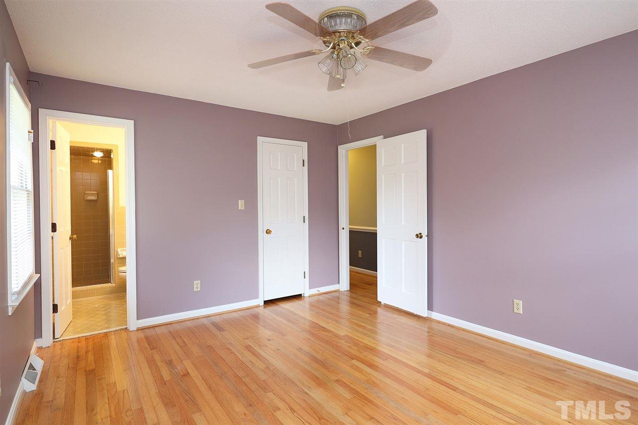 5027 Winterlochen Road Raleigh, NC 27603 - Photo 13 of 25 wooden floor in an empty room with a window