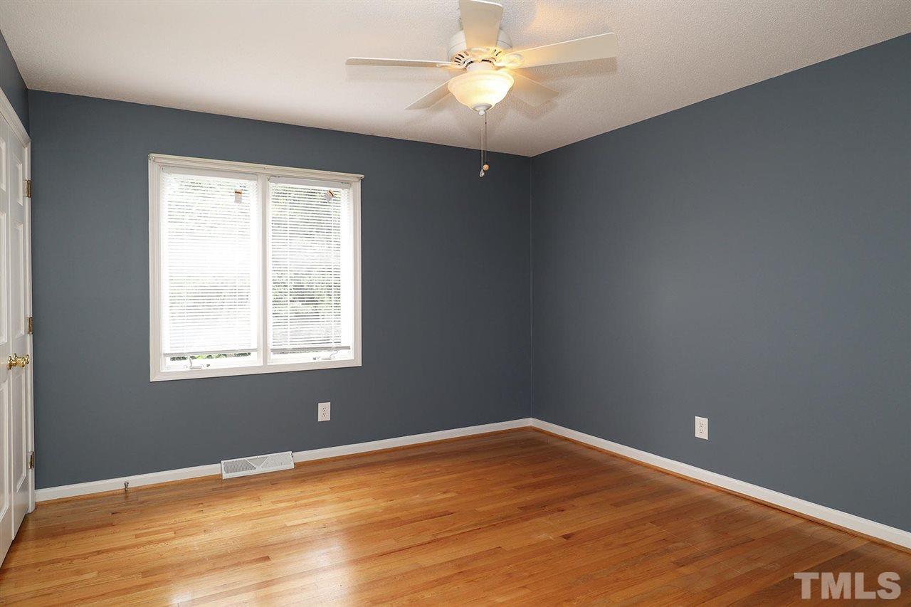 5027 Winterlochen Road Raleigh, NC 27603 - Photo 16 of 25 an empty room with a window and ceiling fan
