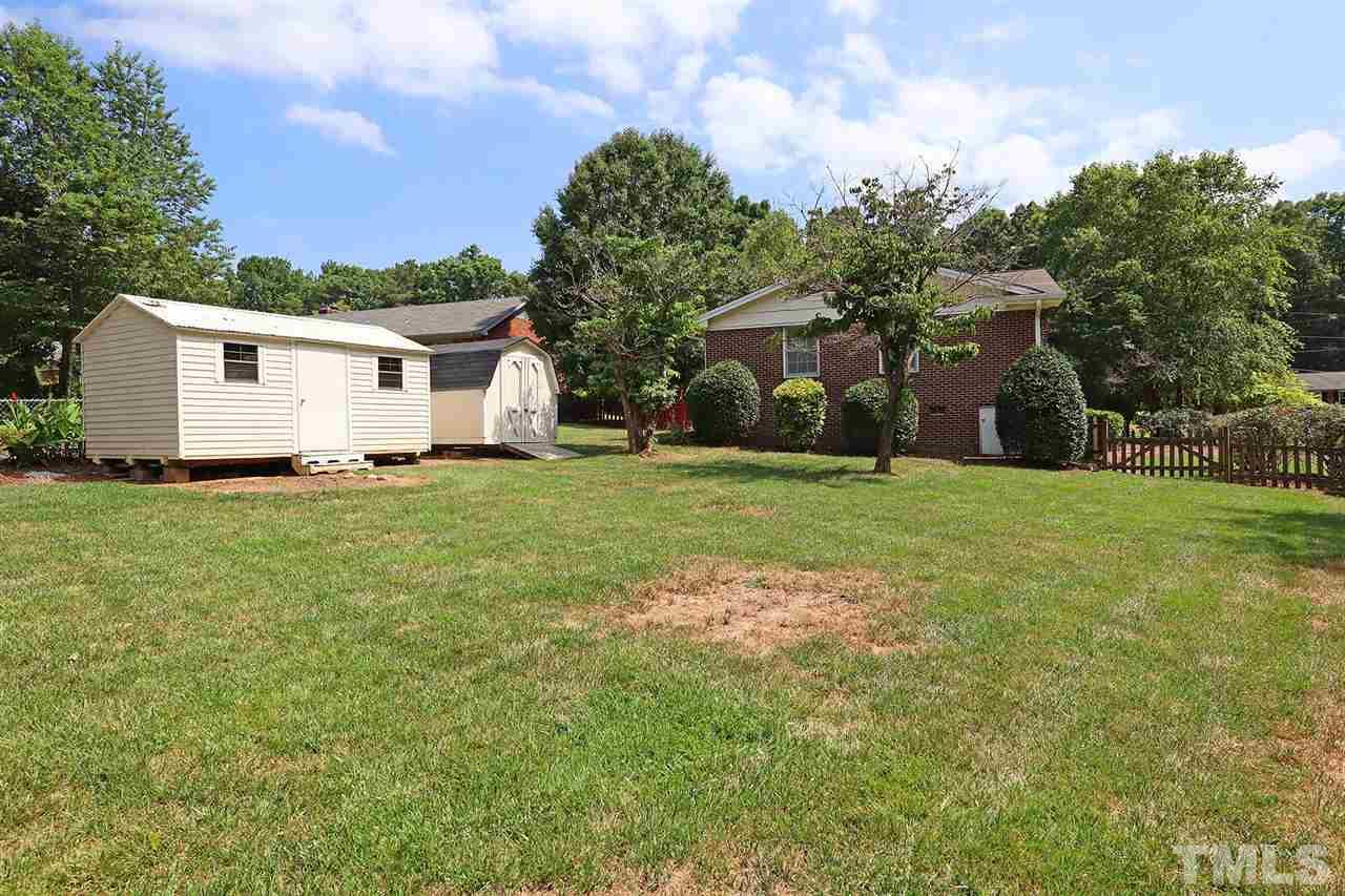 5027 Winterlochen Road Raleigh, NC 27603 - Photo 22 of 25 a view of a house with a yard
