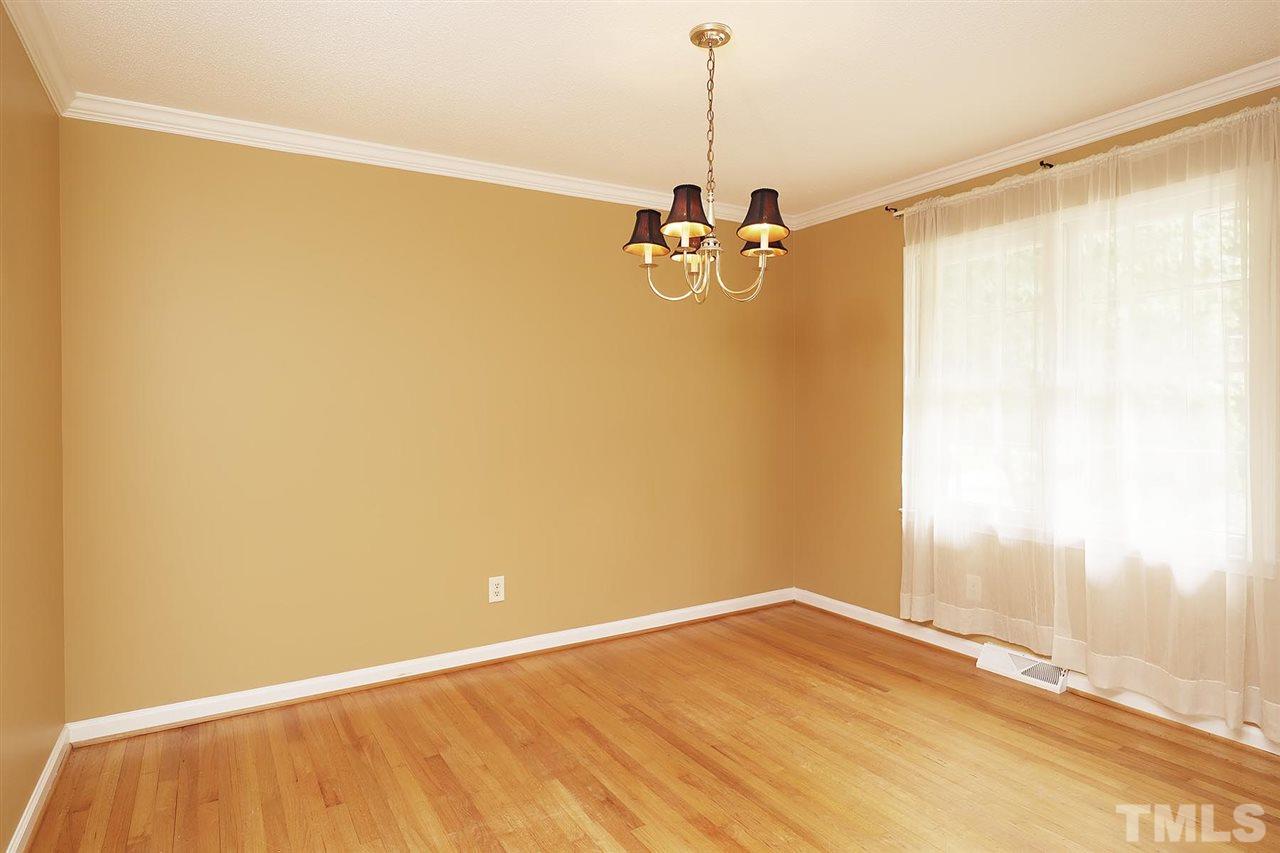 5027 Winterlochen Road Raleigh, NC 27603 - Photo 6 of 25 a view of an empty room with a window