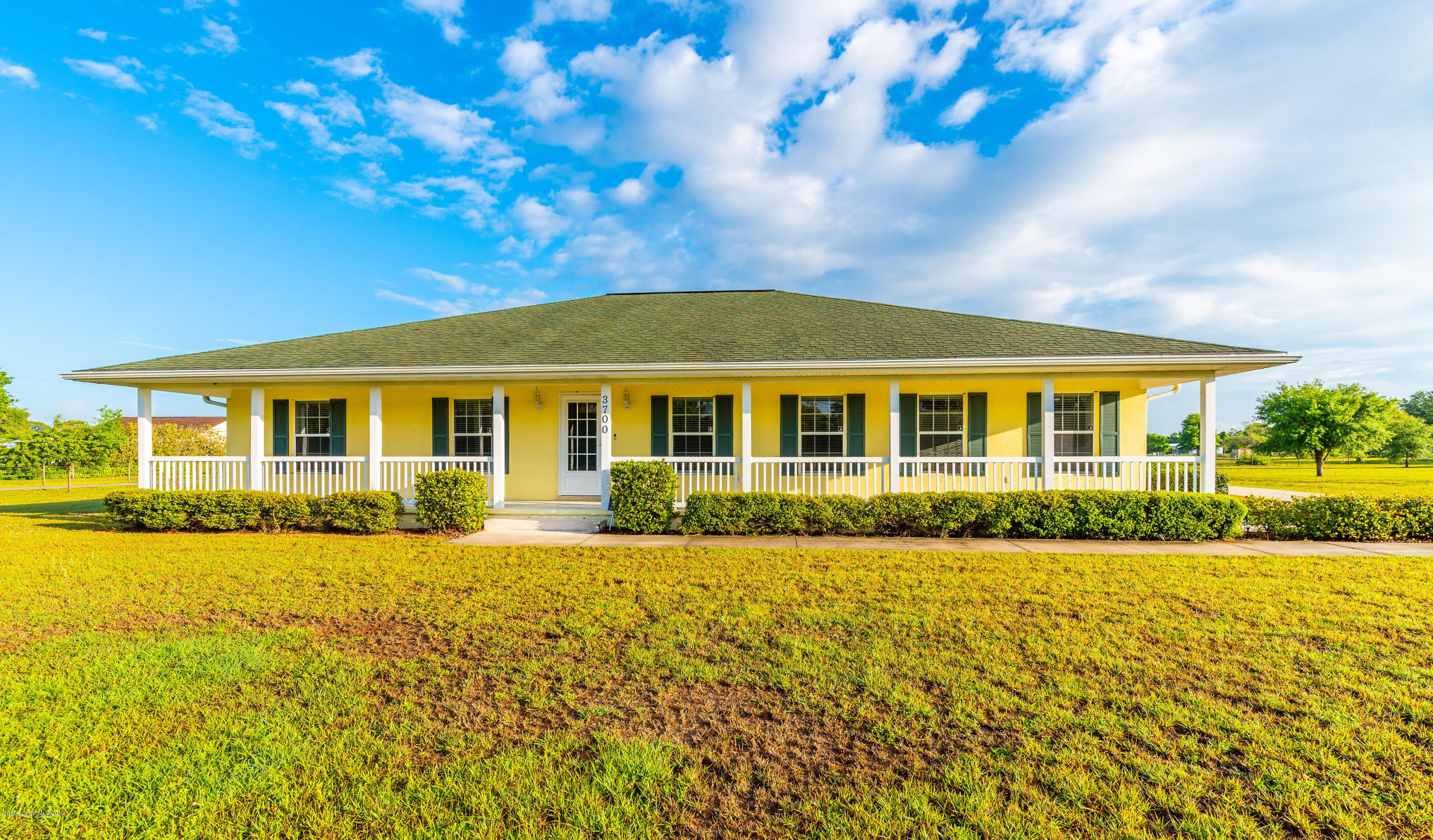 3700 Grant Line Road Mims, FL 32754 - Photo 1 of 40 a view of a house with a yard