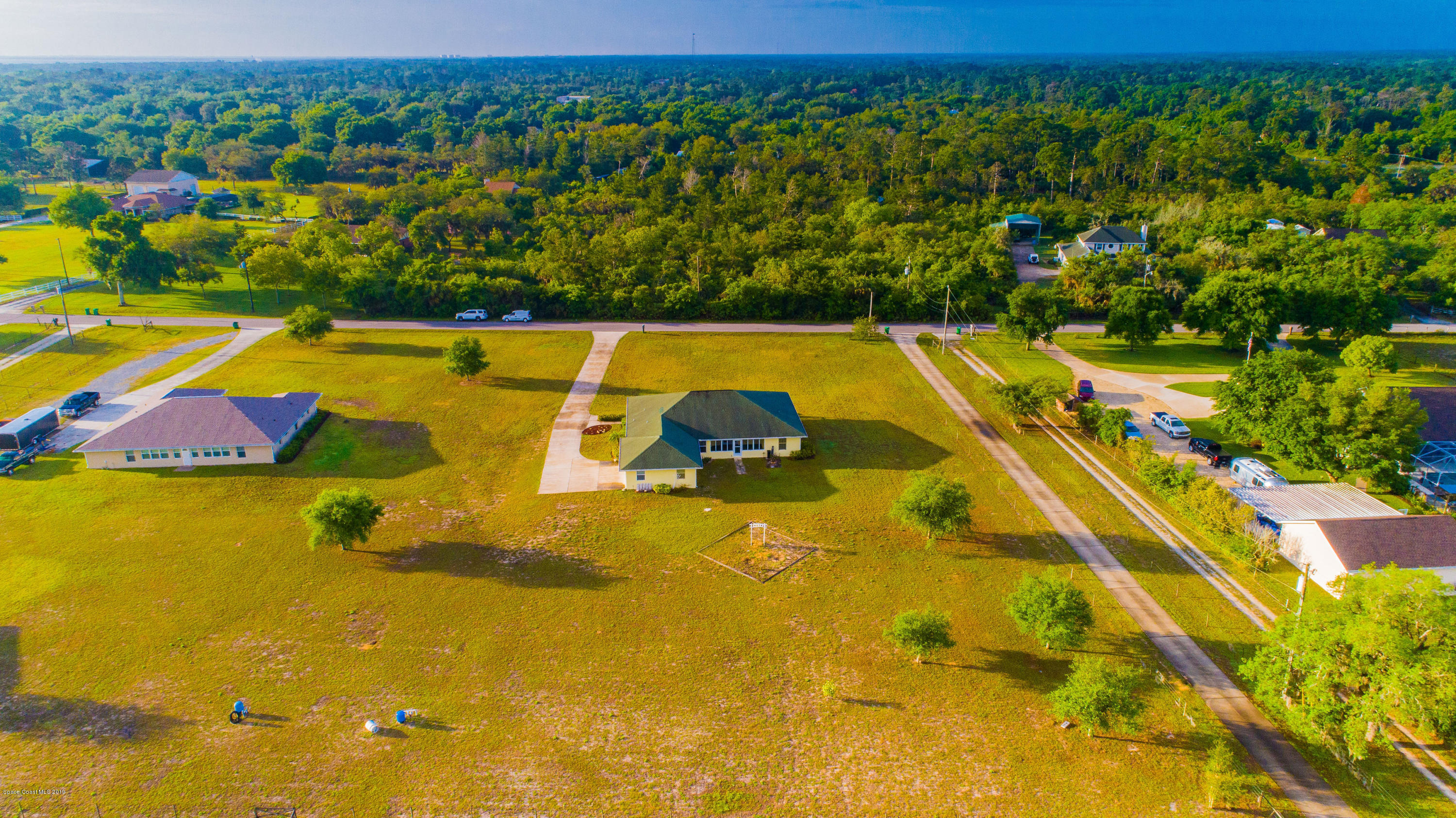 3700 Grant Line Road Mims, FL 32754 - Photo 38 of 40 a view of a swimming pool with an outdoor seating and yard