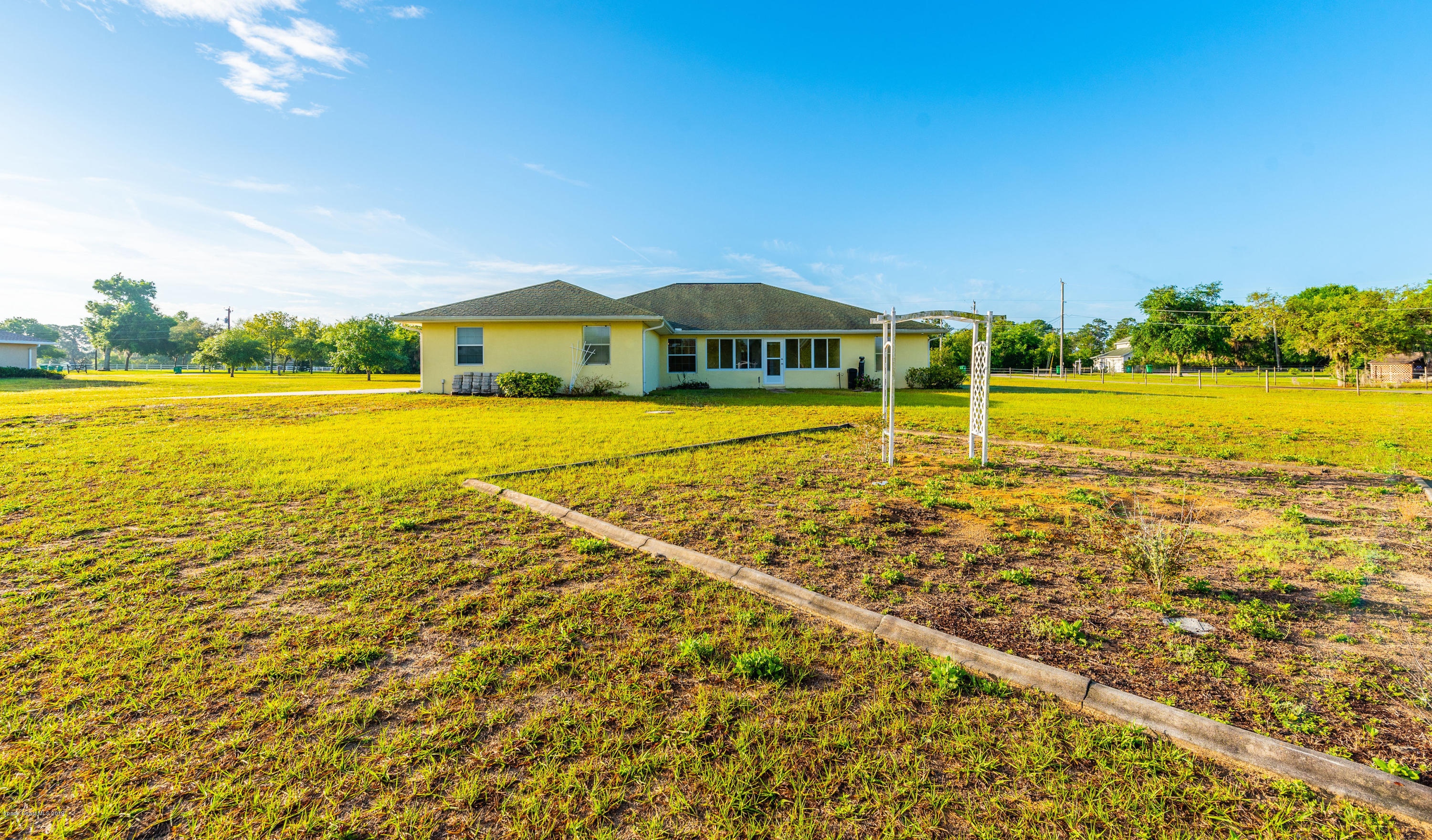 3700 Grant Line Road Mims, FL 32754 - Photo 5 of 40 a view of a house with a yard