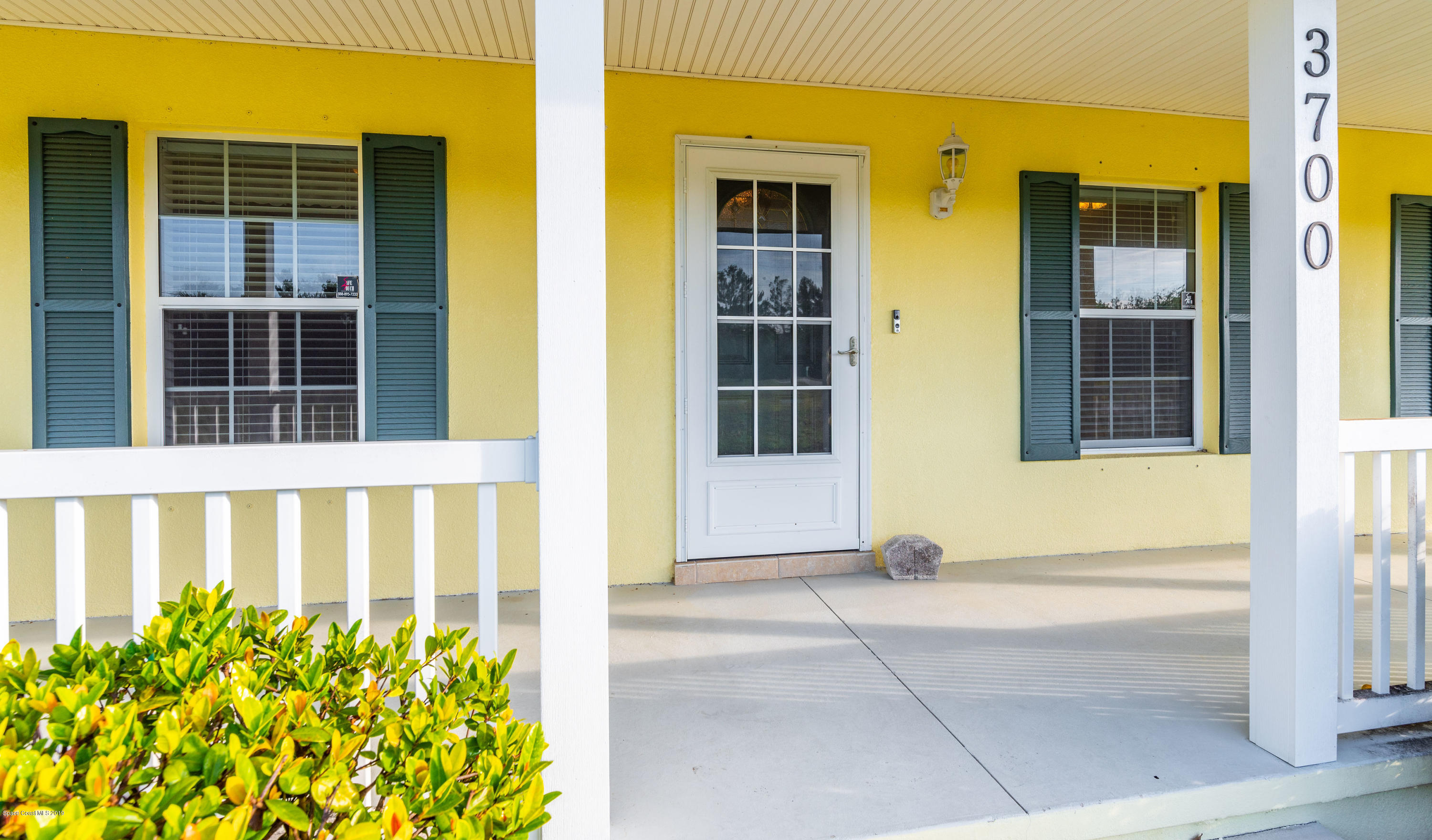 3700 Grant Line Road Mims, FL 32754 - Photo 9 of 40 a view of front door of house with a garden