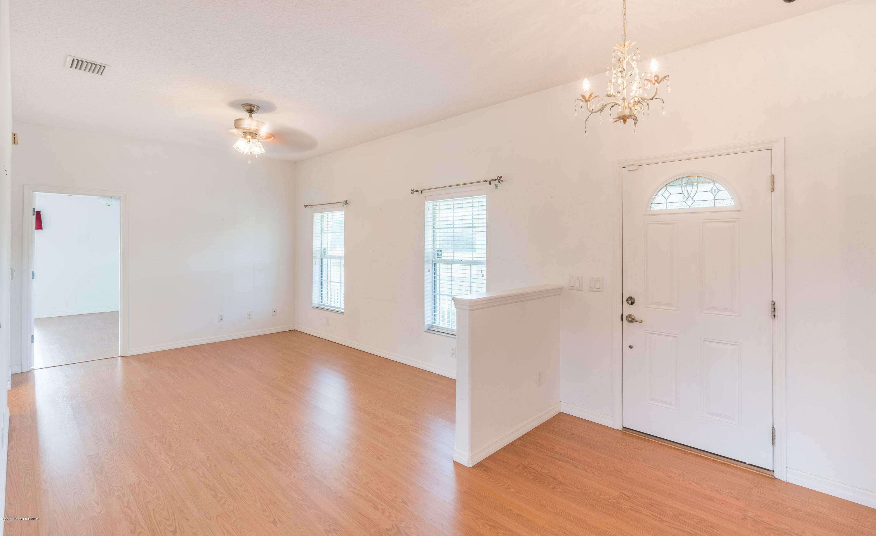 3700 Grant Line Road Mims, FL 32754 - Photo 10 of 40 wooden floor in an empty room with a window