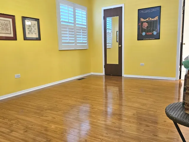 a bathroom with a granite countertop sink and a toilet