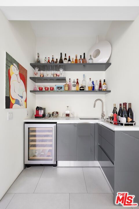 2654 Roscomare Road Los Angeles, CA 90077 - Photo 11 of 29 a view of cabinet with lots of clutter and cabinets