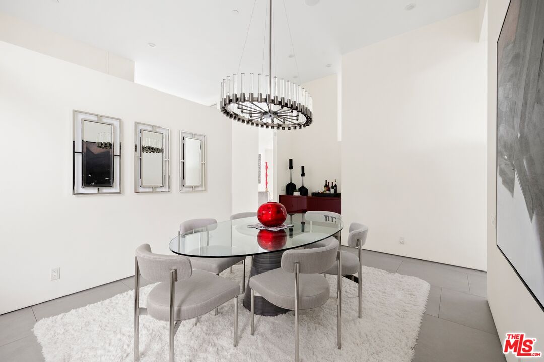 2654 Roscomare Road Los Angeles, CA 90077 - Photo 13 of 29 a dining room with furniture and window