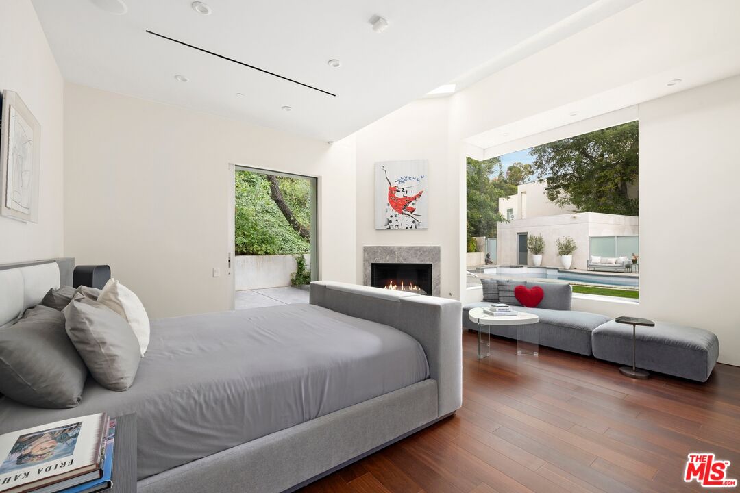 2654 Roscomare Road Los Angeles, CA 90077 - Photo 17 of 29 a bedroom with a bed and a couch