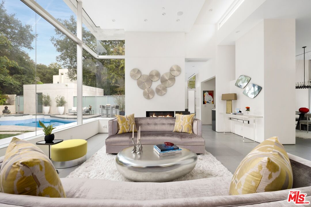 2654 Roscomare Road Los Angeles, CA 90077 - Photo 2 of 29 a living room with furniture and a large window