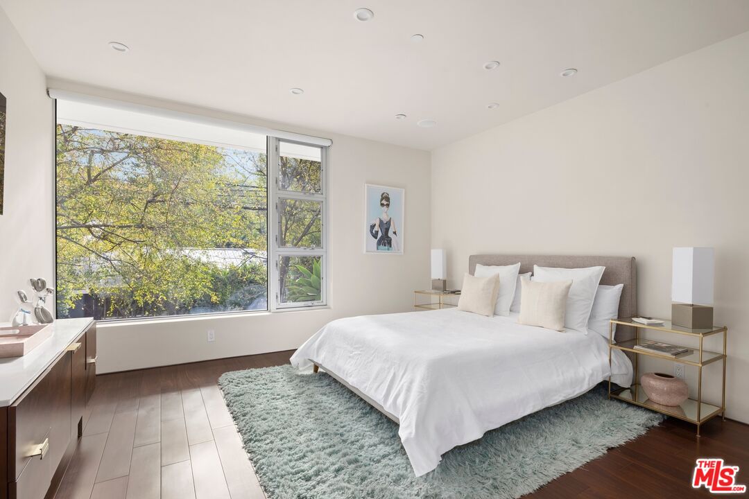 2654 Roscomare Road Los Angeles, CA 90077 - Photo 21 of 29 a bedroom with a bed and large window