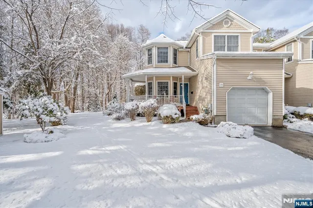 a front view of a house with backyard