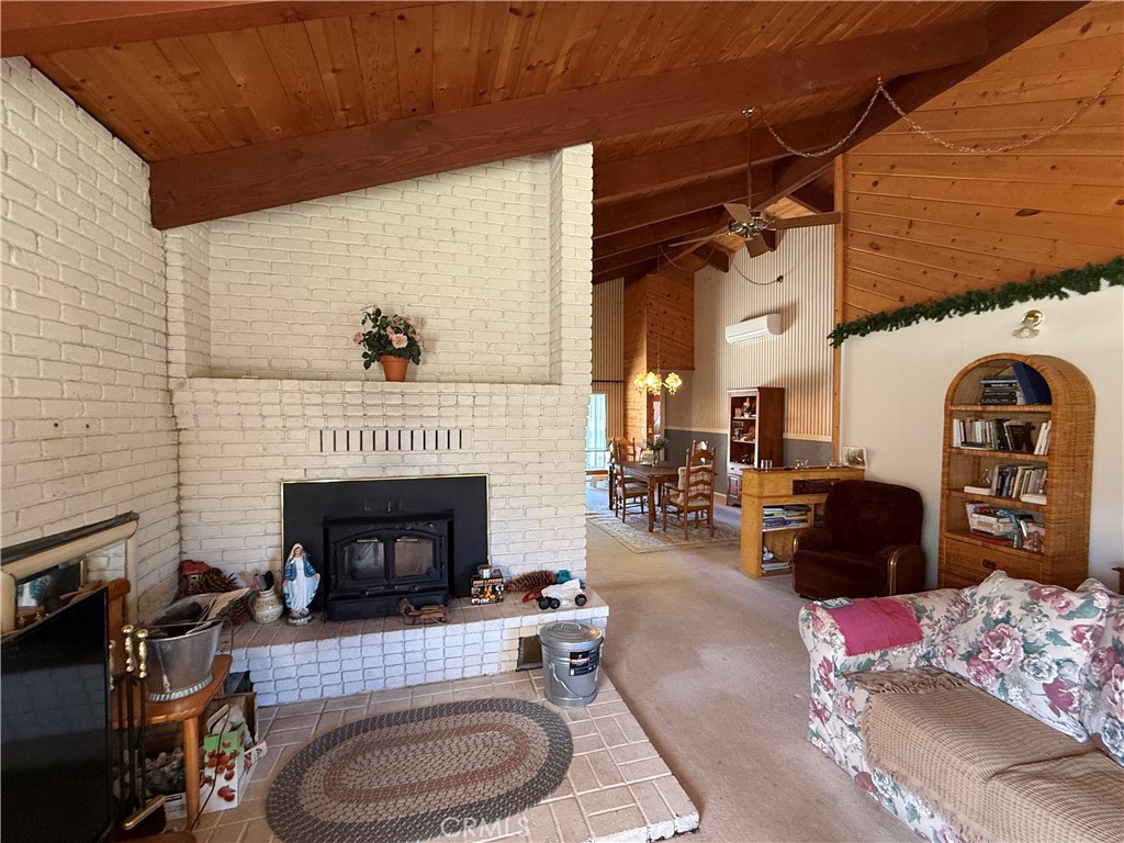 4952 Hidden Springs Road Mariposa, CA 95338 - Photo 14 of 53 a living room with furniture and a fireplace