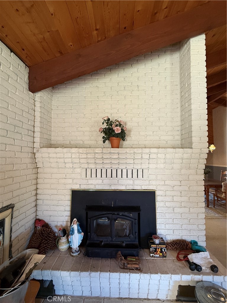4952 Hidden Springs Road Mariposa, CA 95338 - Photo 15 of 53 a living room with furniture and a fireplace