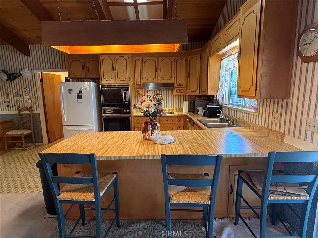 4952 Hidden Springs Road Mariposa, CA 95338 - Photo 19 of 53 a view of a dining room with furniture and window
