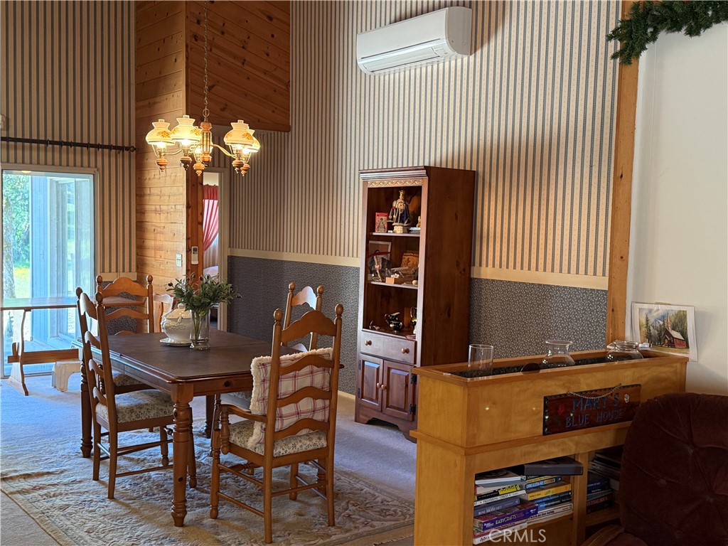 4952 Hidden Springs Road Mariposa, CA 95338 - Photo 22 of 53 a view of a dining room with furniture and chandelier