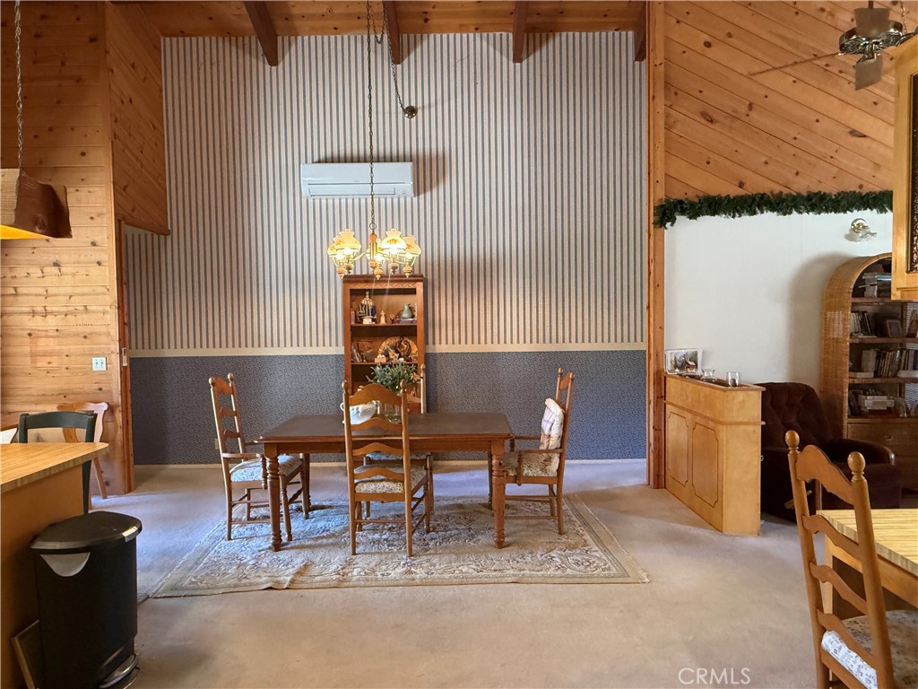 4952 Hidden Springs Road Mariposa, CA 95338 - Photo 23 of 53 a view of a dining room with furniture and chandelier