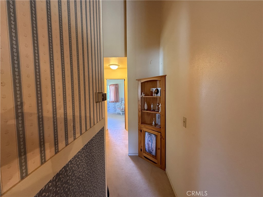 4952 Hidden Springs Road Mariposa, CA 95338 - Photo 29 of 53 a view of a hallway with wooden floor