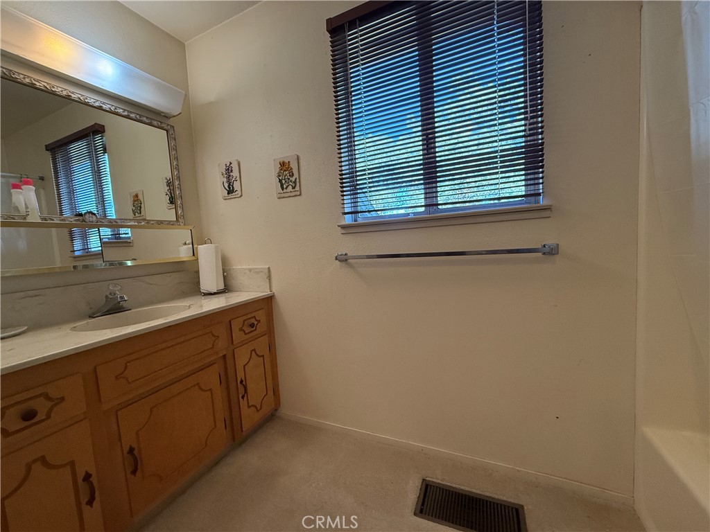 4952 Hidden Springs Road Mariposa, CA 95338 - Photo 33 of 53 a bathroom with a sink and a mirror